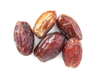 Photo of Many tasty dried dates isolated on white, top view