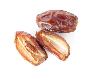 Photo of Three tasty dried dates isolated on white, top view