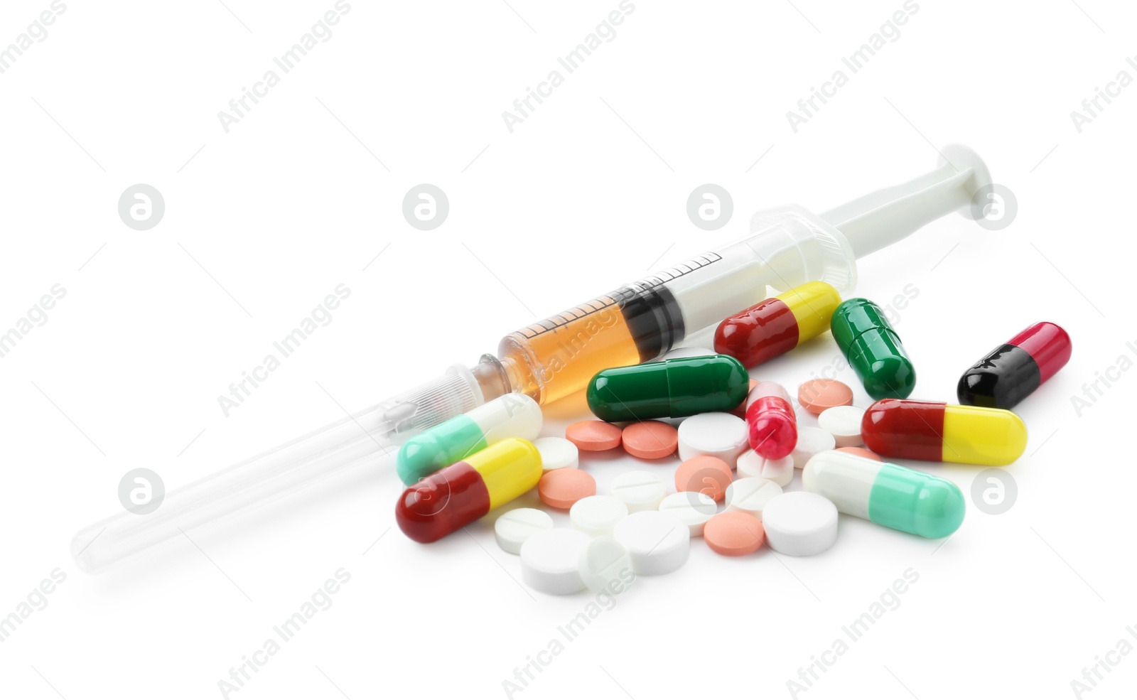 Photo of Drug addiction. Different pills and syringe isolated on white