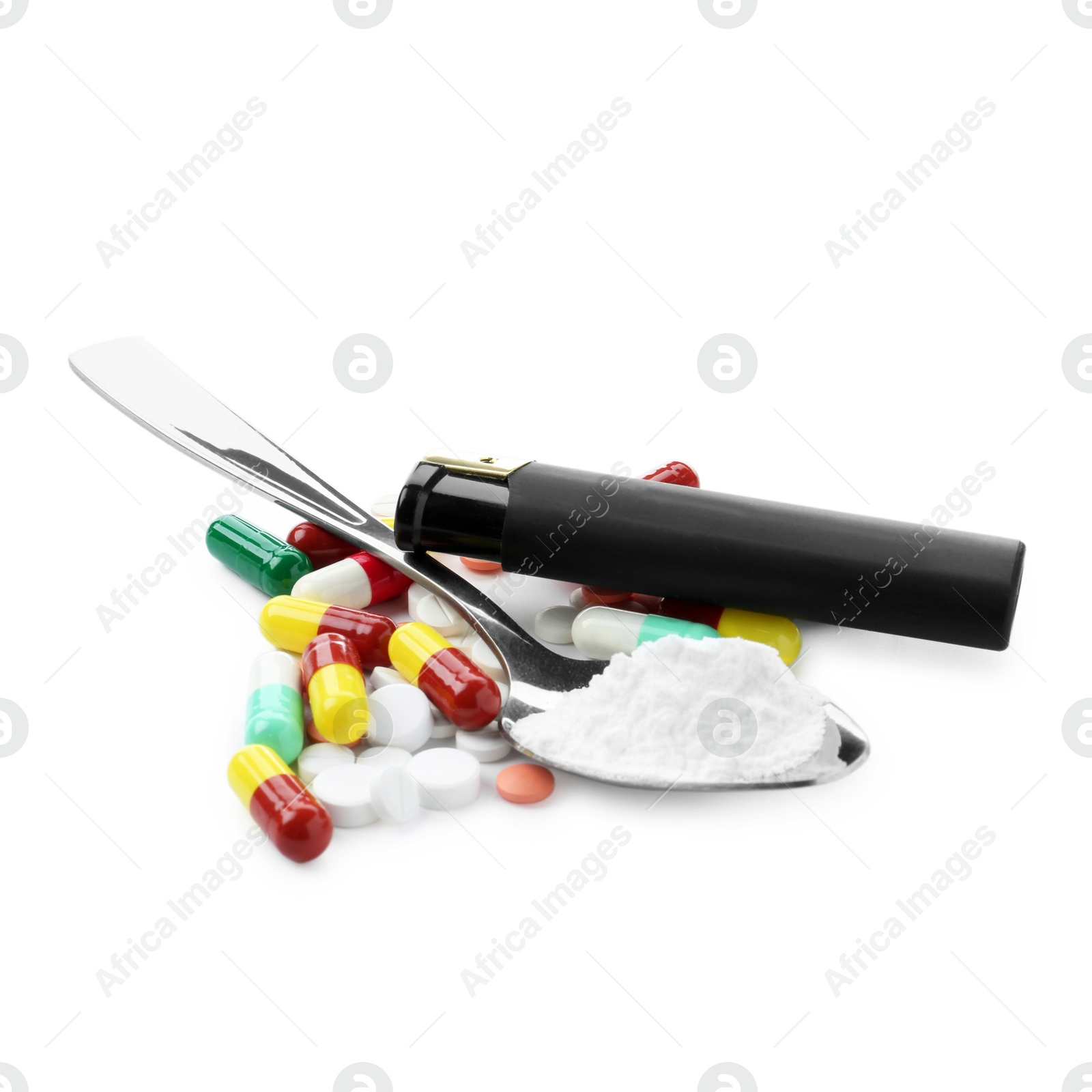 Photo of Drug addiction. Different pills, spoon with powder and cigarette lighter isolated on white