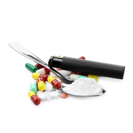 Photo of Drug addiction. Different pills, spoon with powder and cigarette lighter isolated on white