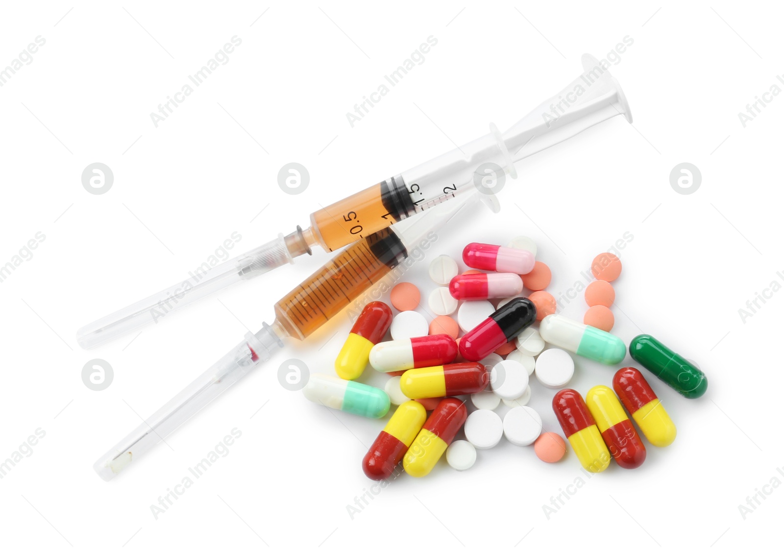 Photo of Drug addiction. Different pills and syringes isolated on white, top view