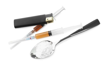 Photo of Drug addiction. Spoon with powder, cigarette lighter and syringes isolated on white, top view