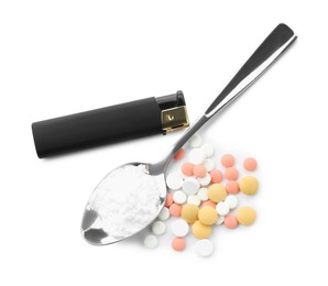 Photo of Drug addiction. Different pills, spoon with powder and cigarette lighter isolated on white, top view