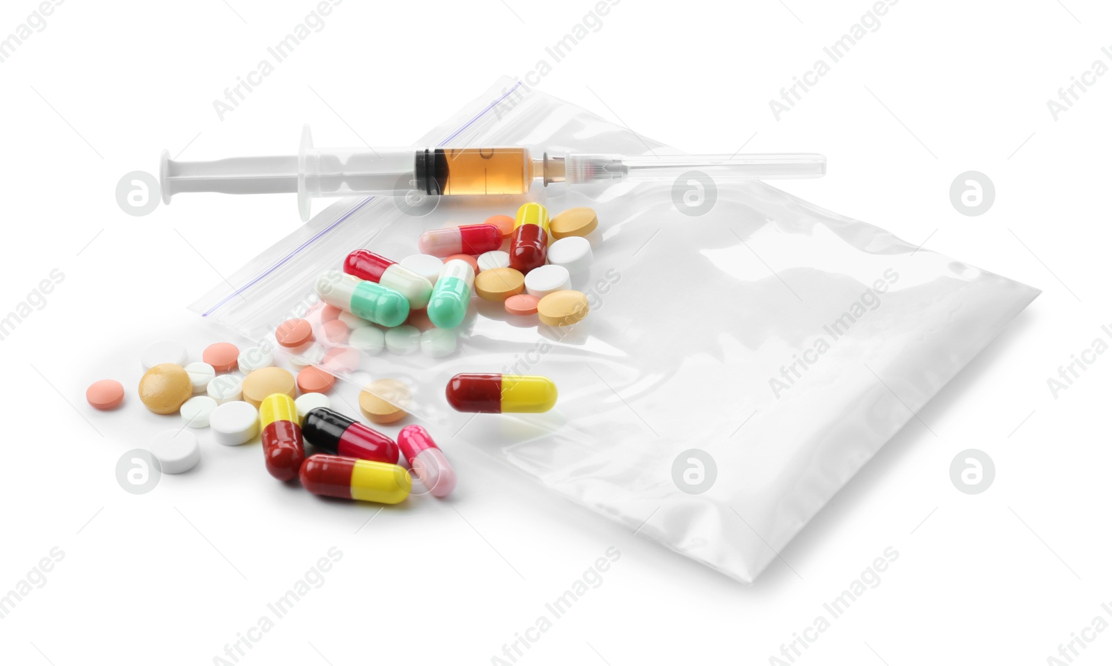 Photo of Drug addiction. Different pills, plastic bag with powder and syringe isolated on white