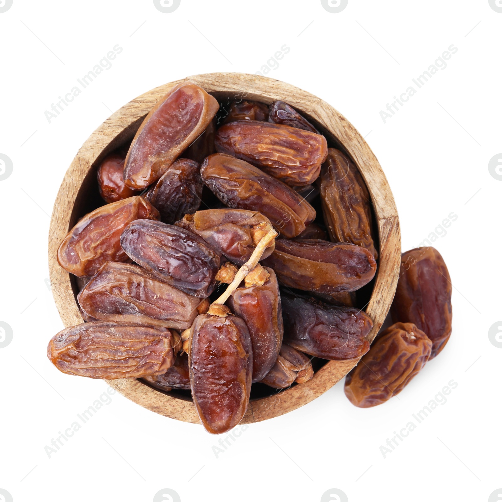 Photo of Tasty dried dates in bowl isolated on white, top view