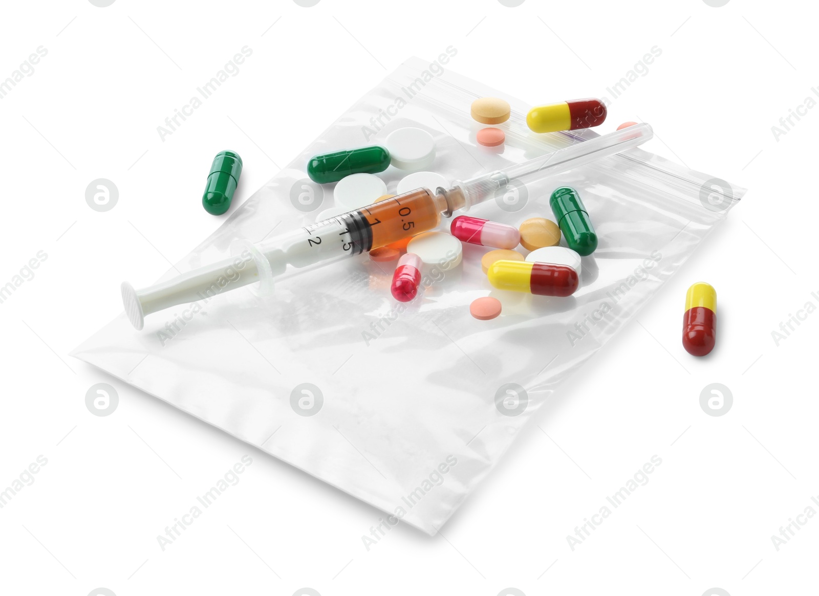 Photo of Drug addiction. Different pills, plastic bag with powder and syringe isolated on white