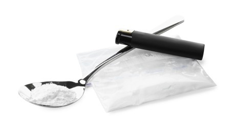 Photo of Drug addiction. Plastic bag with powder, spoon and cigarette lighter isolated on white