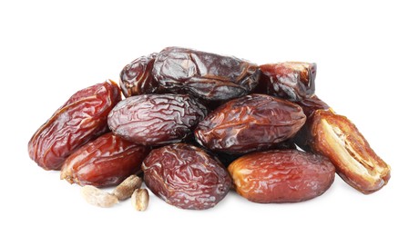 Photo of Many tasty dried dates with seeds isolated on white