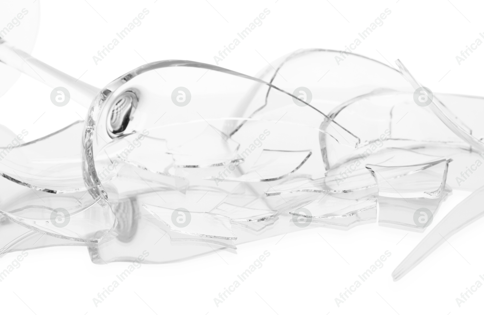 Photo of Pieces of broken wine glass isolated on white