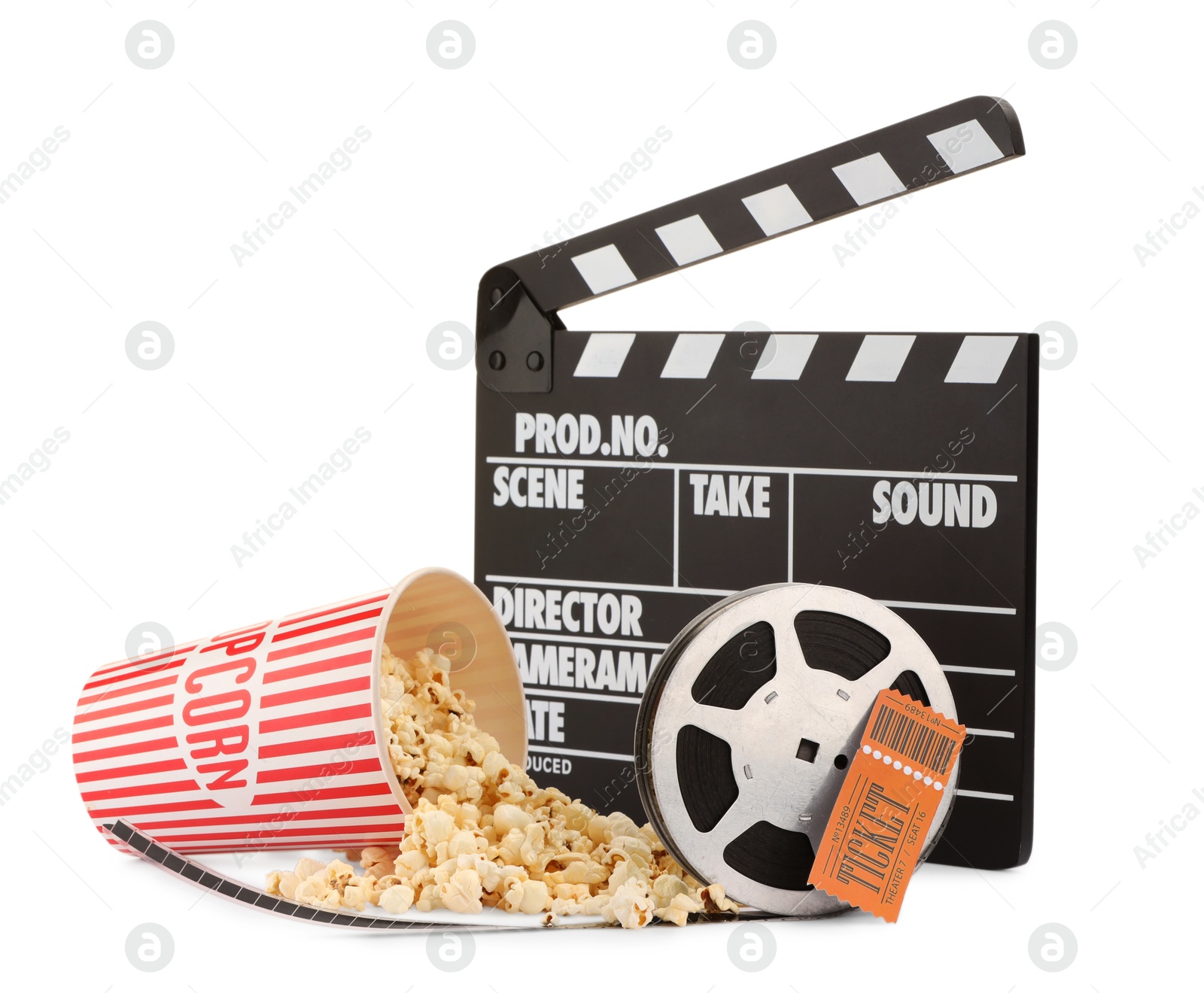 Photo of Tasty popcorn, film reel, clapper and movie ticket isolated on white