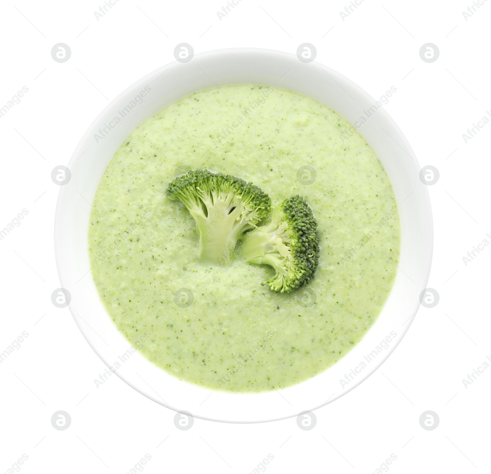 Photo of Delicious broccoli cream soup in bowl isolated on white, top view