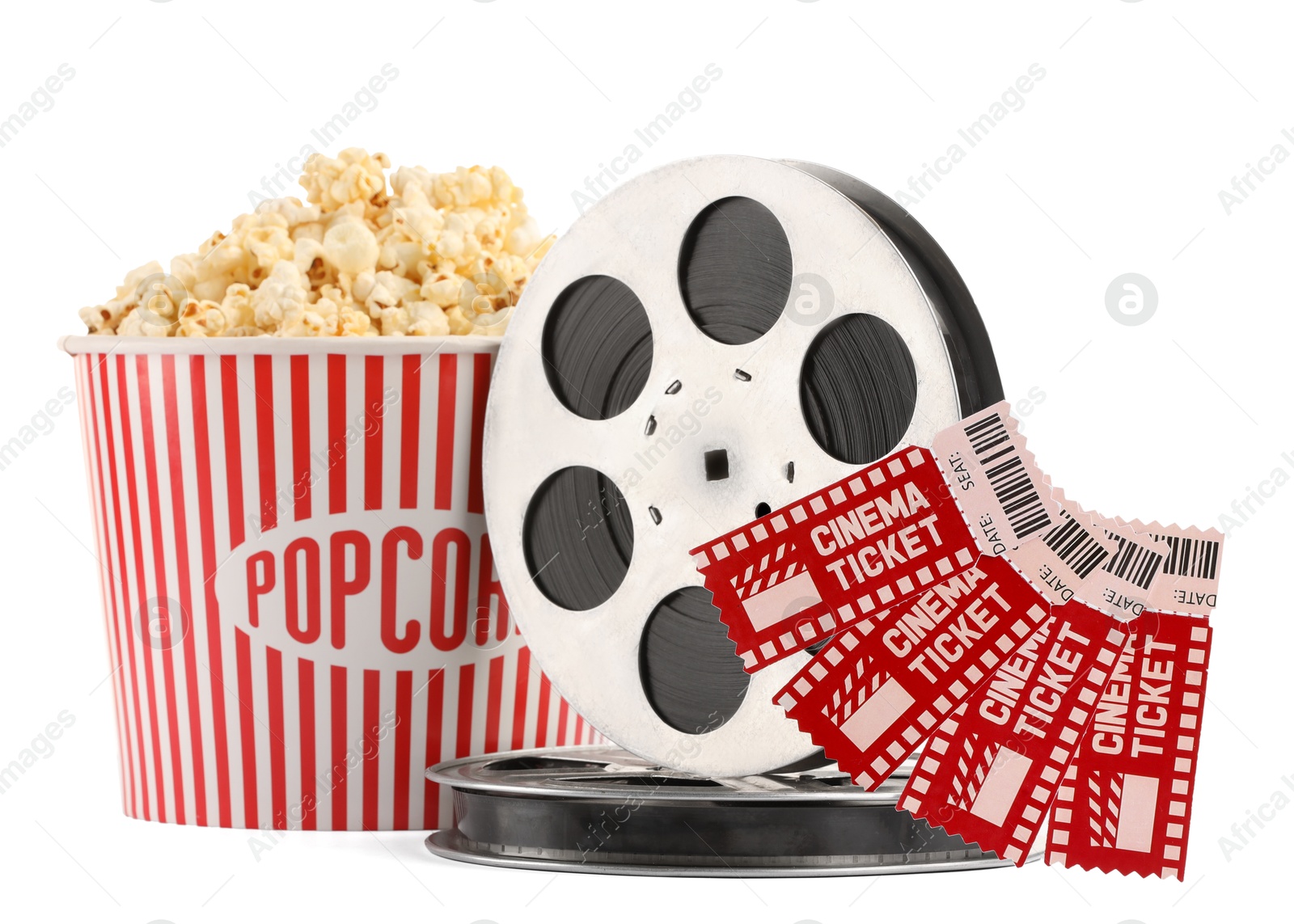 Photo of Tasty popcorn, film reels and movie tickets isolated on white