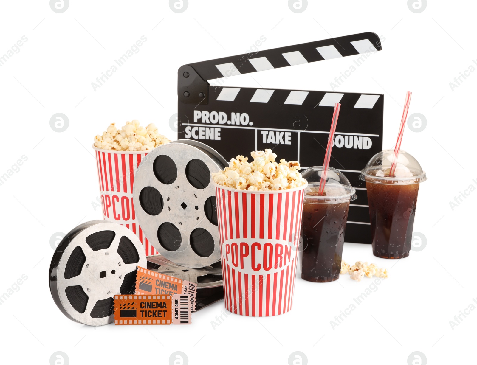 Photo of Tasty popcorn, film reels, clapper, soda drinks and movie tickets isolated on white