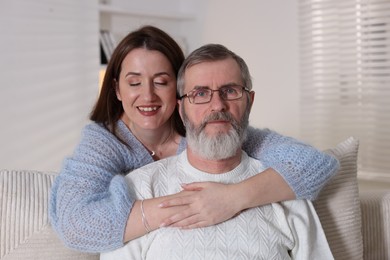 Photo of Family portrait of happy adult daughter and her father at home