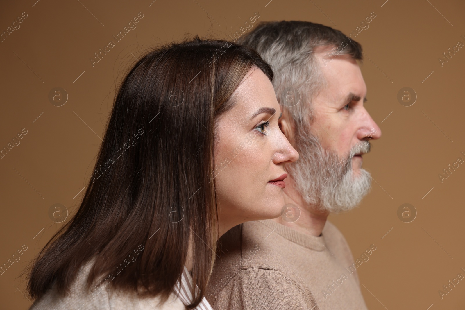 Photo of Daughter and her father on brown background