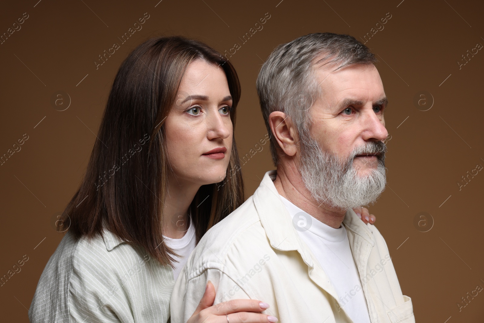 Photo of Daughter and her father on brown background