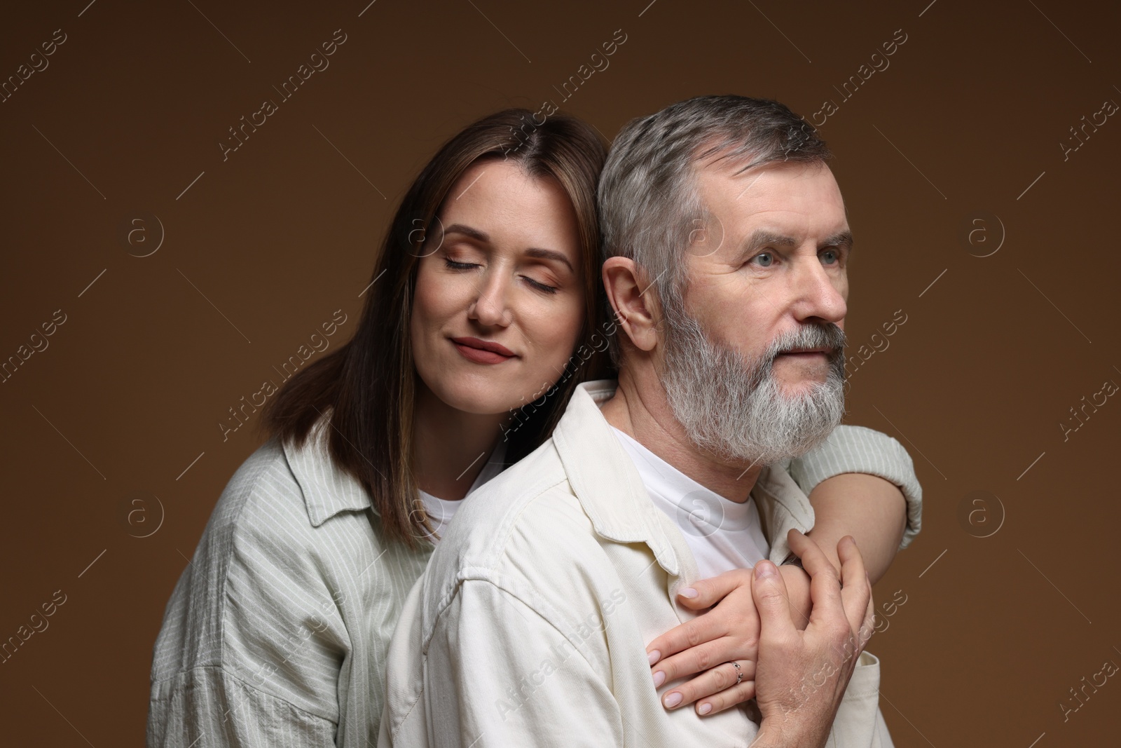 Photo of Daughter and her father on brown background