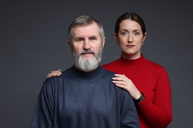 Photo of Family portrait of daughter and her father on dark background