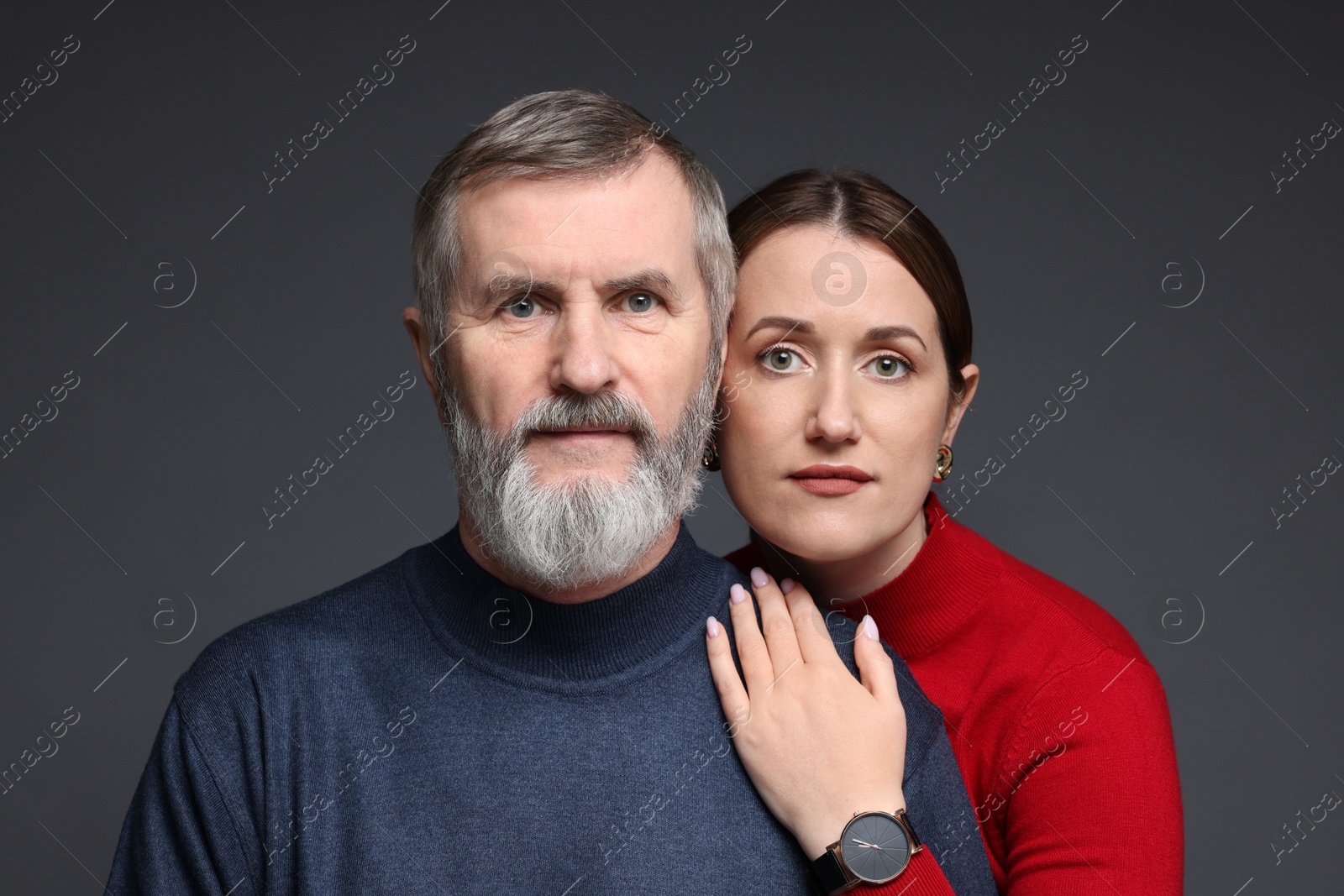 Photo of Family portrait of daughter and her father on dark background