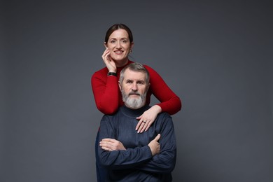 Photo of Family portrait of daughter and her father on dark background