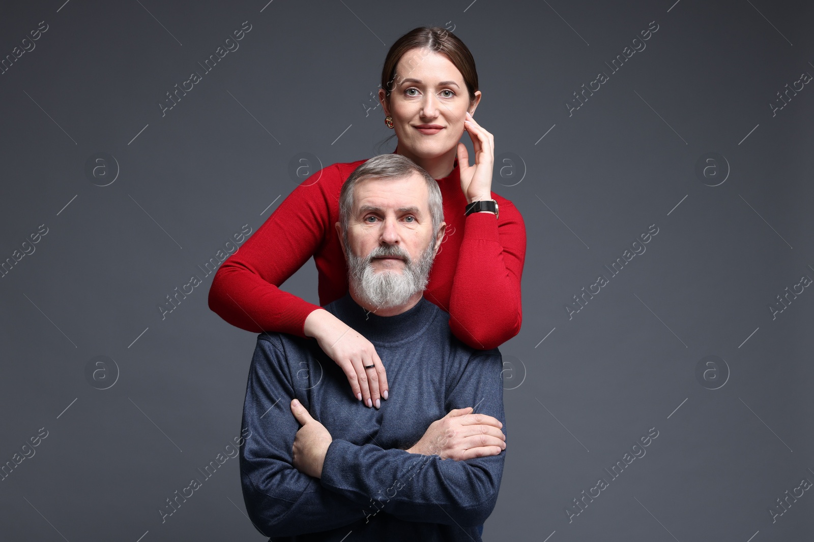 Photo of Family portrait of daughter and her father on dark background