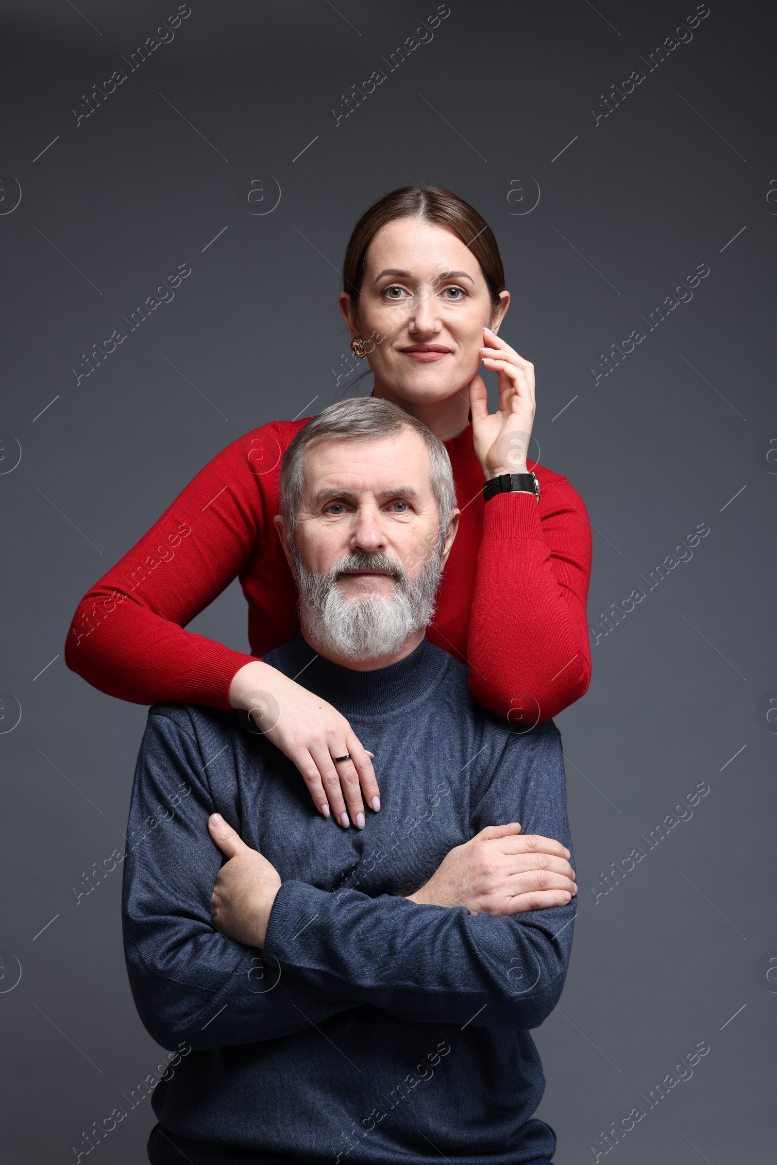 Photo of Family portrait of daughter and her father on dark background