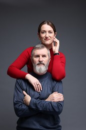 Photo of Family portrait of daughter and her father on dark background