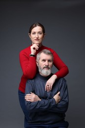 Photo of Family portrait of daughter and her father on dark background