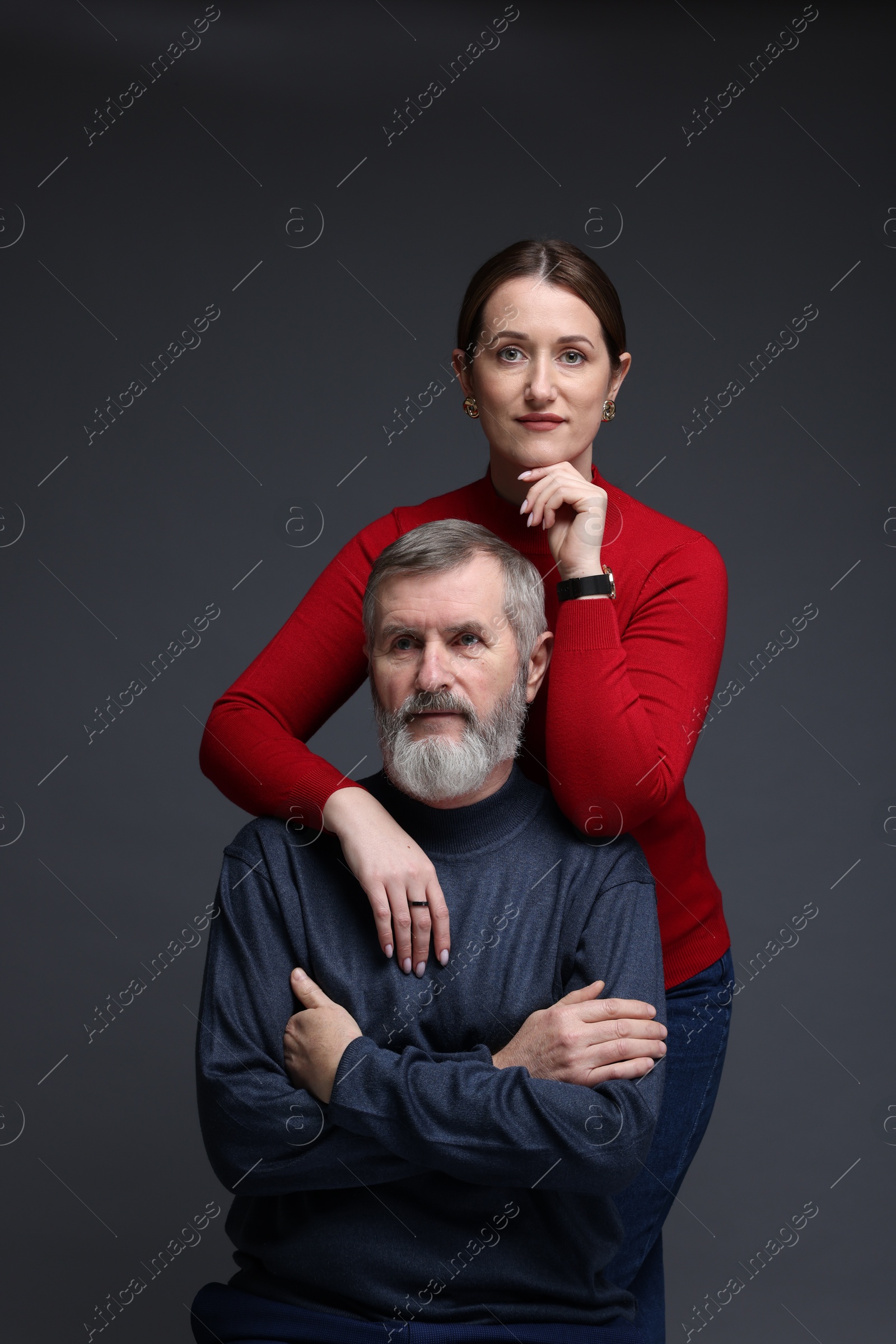 Photo of Family portrait of daughter and her father on dark background