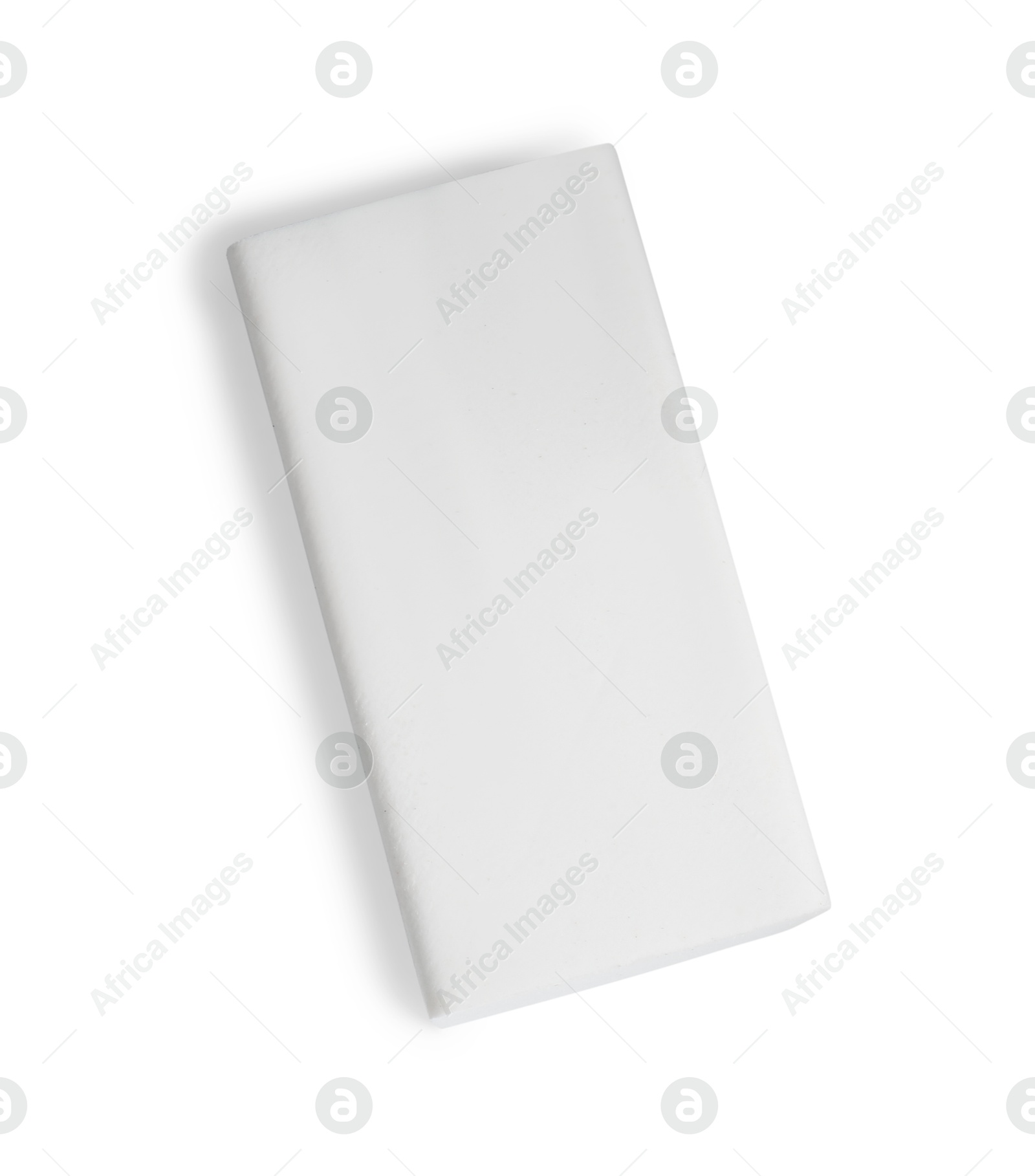 Photo of New eraser isolated on white, top view. School stationery