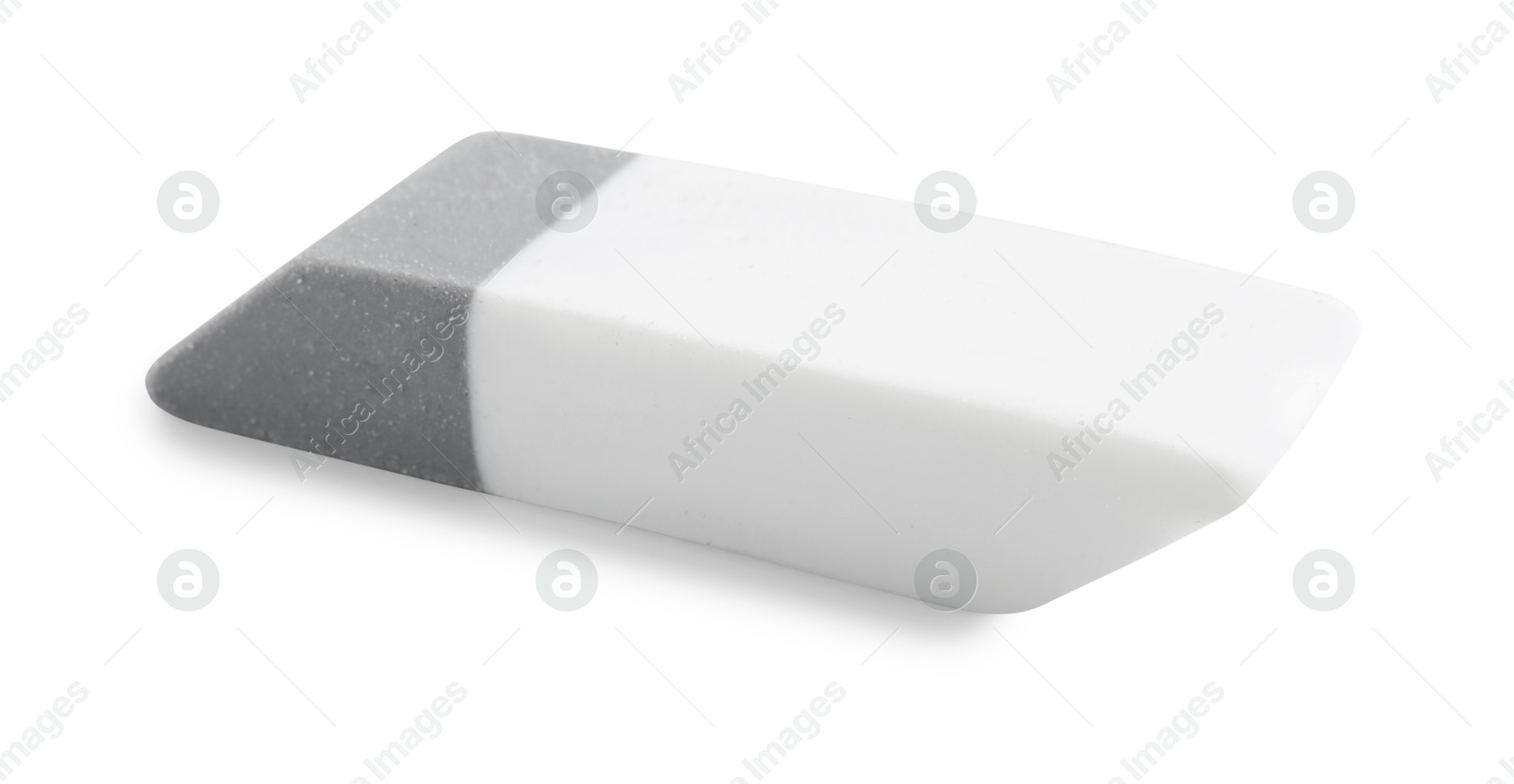 Photo of New eraser isolated on white. School stationery