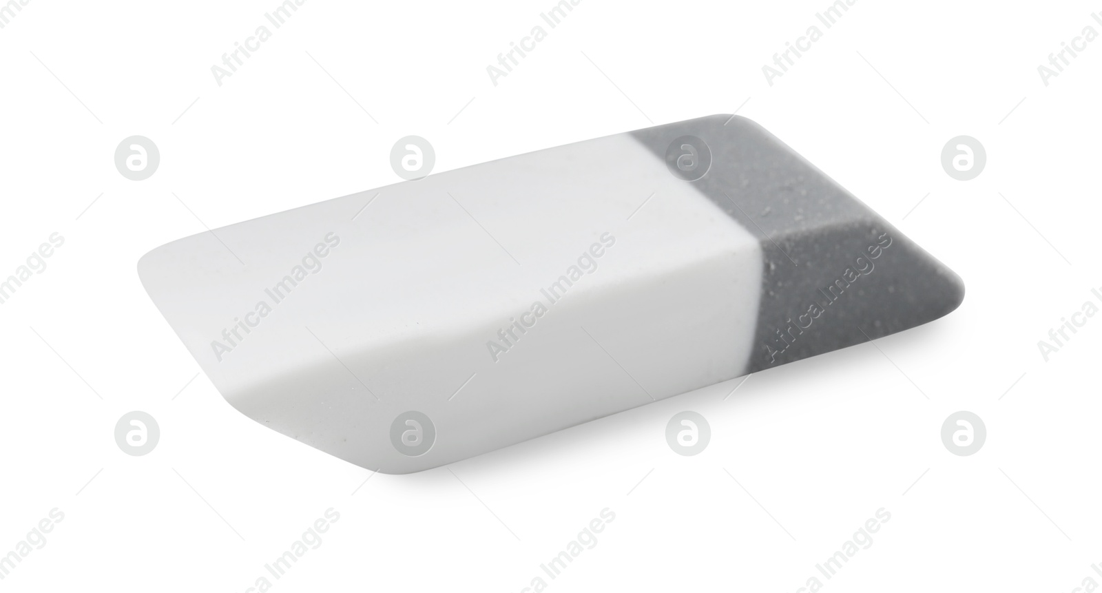 Photo of New eraser isolated on white. School stationery