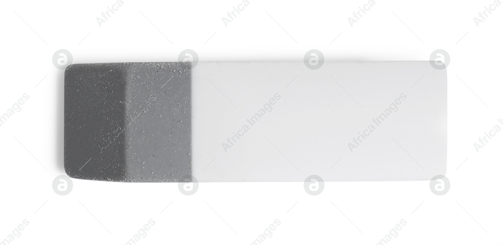 Photo of New eraser isolated on white, top view. School stationery