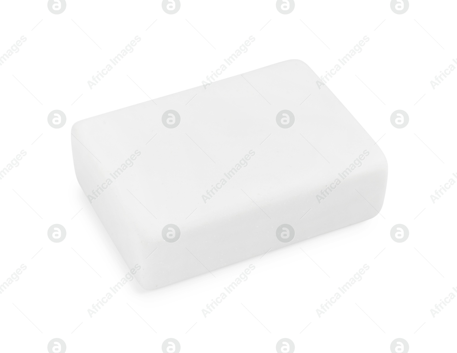 Photo of New eraser isolated on white. School stationery