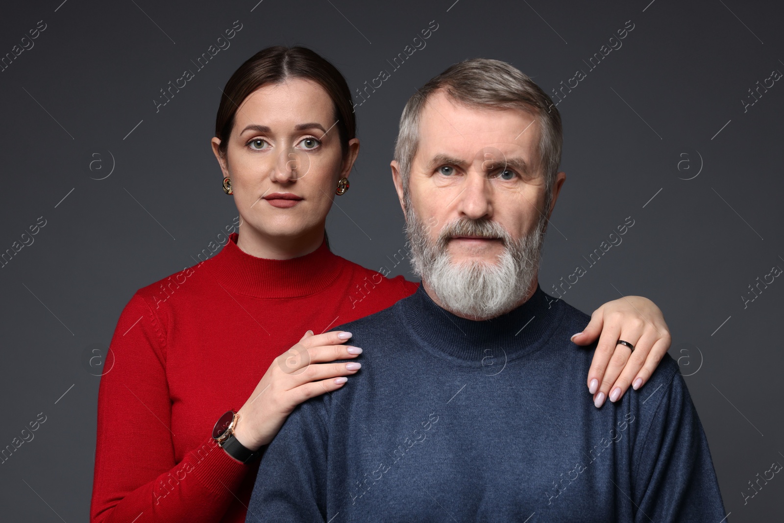 Photo of Family portrait of daughter and her father on dark background