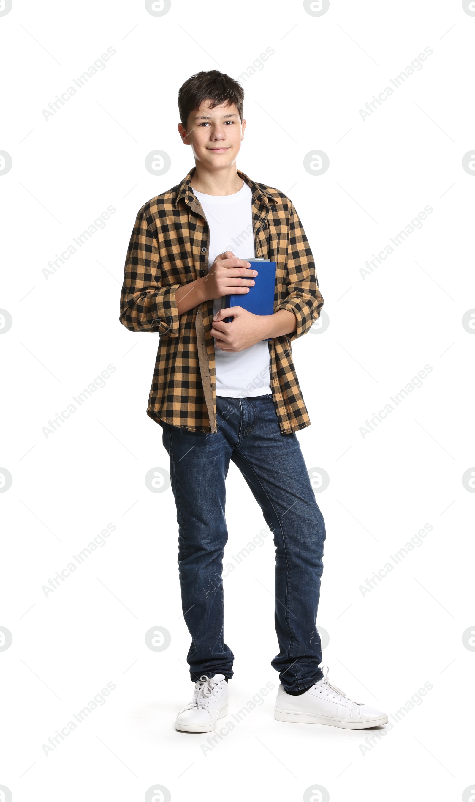 Photo of Full length portrait of teenage boy with books on white background