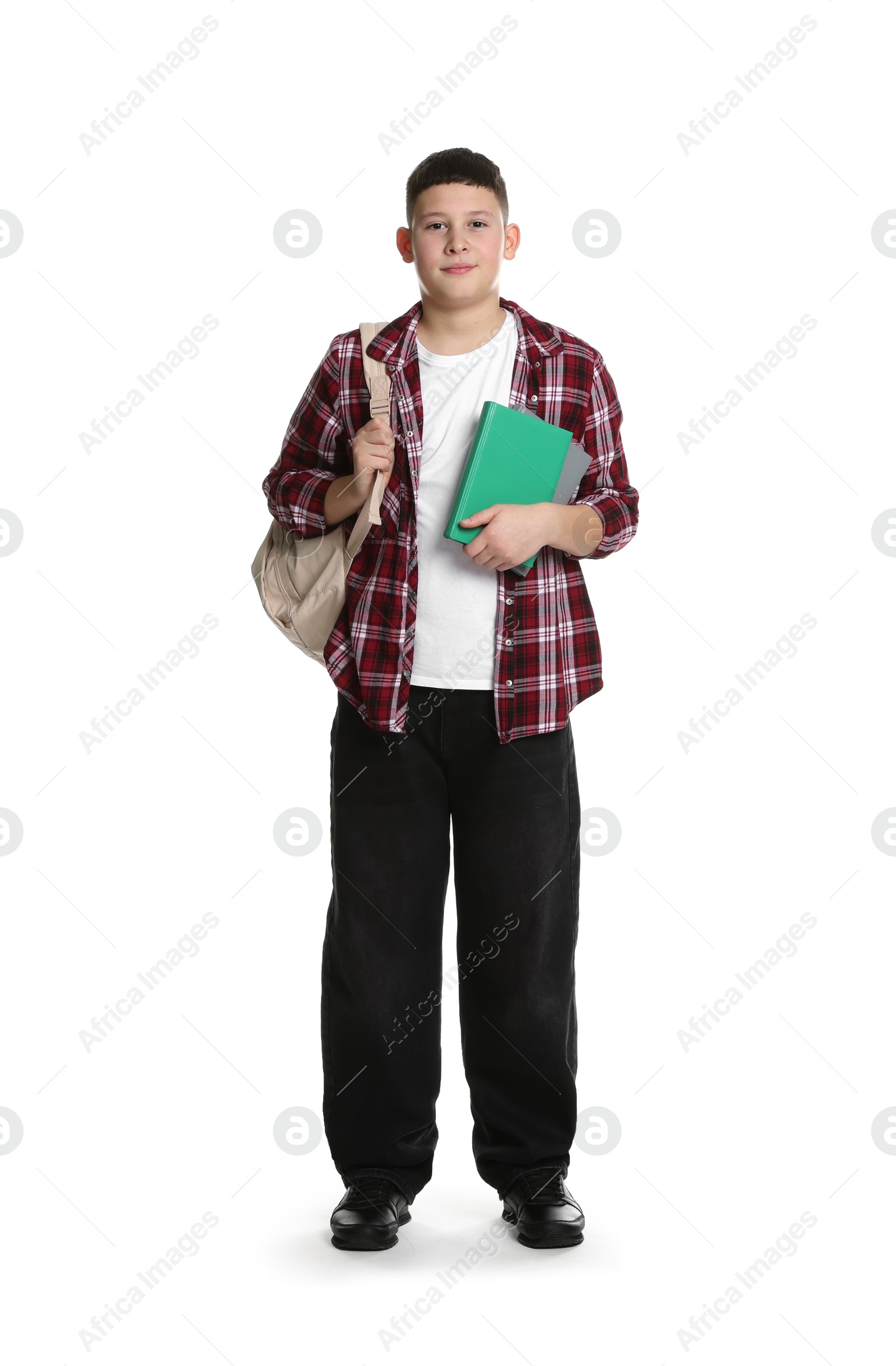 Photo of Full length portrait of teenage boy with books and backpack on white background