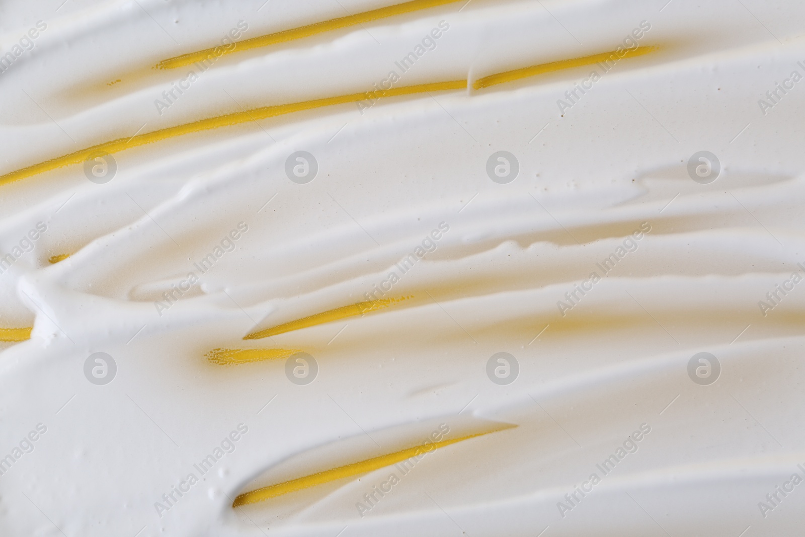 Photo of Sample of fluffy foam on orange background, top view