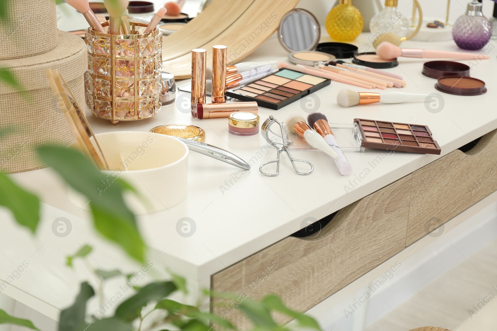 Photo of Makeup room. Different beauty products on dressing table indoors, closeup