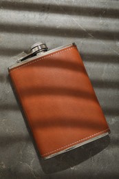 Photo of One hip flask on grey table, top view