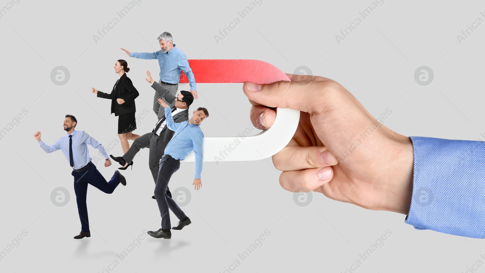 Image of Man with horseshoe magnet in his hand attracting business people on grey background, closeup