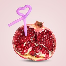 Image of Ripe pomegranate with drinking straw on light grey background. Organic juice or freshly made smoothie concept