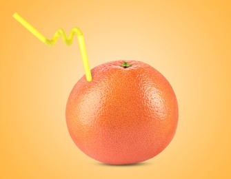 Image of Ripe grapefruit with drinking straw on orange background. Organic juice or freshly made smoothie concept