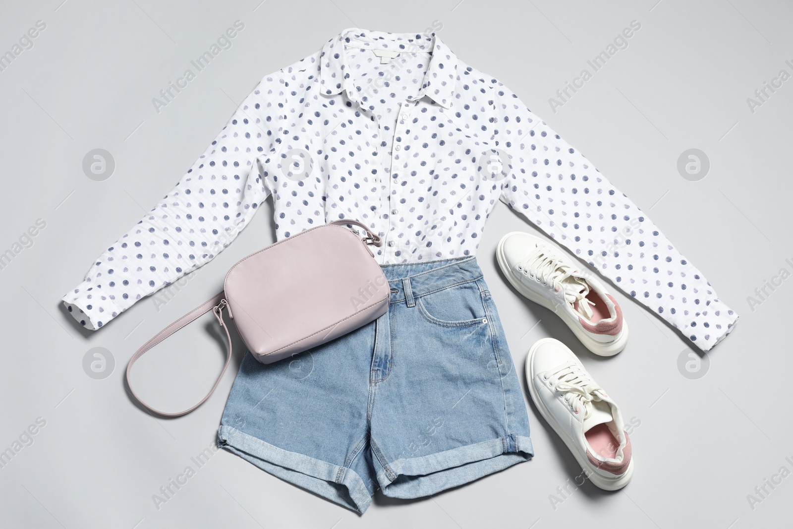 Photo of Stylish outfit with bag on light grey background, flat lay