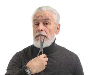 Photo of Bearded senior man holding scissors on white background