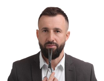 Photo of Bearded man holding scissors on white background