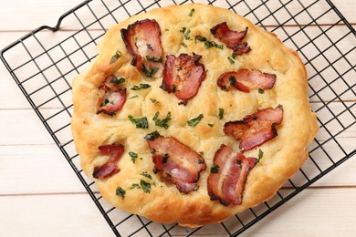 Photo of Delicious focaccia bread with bacon and parsley on white wooden table, top view