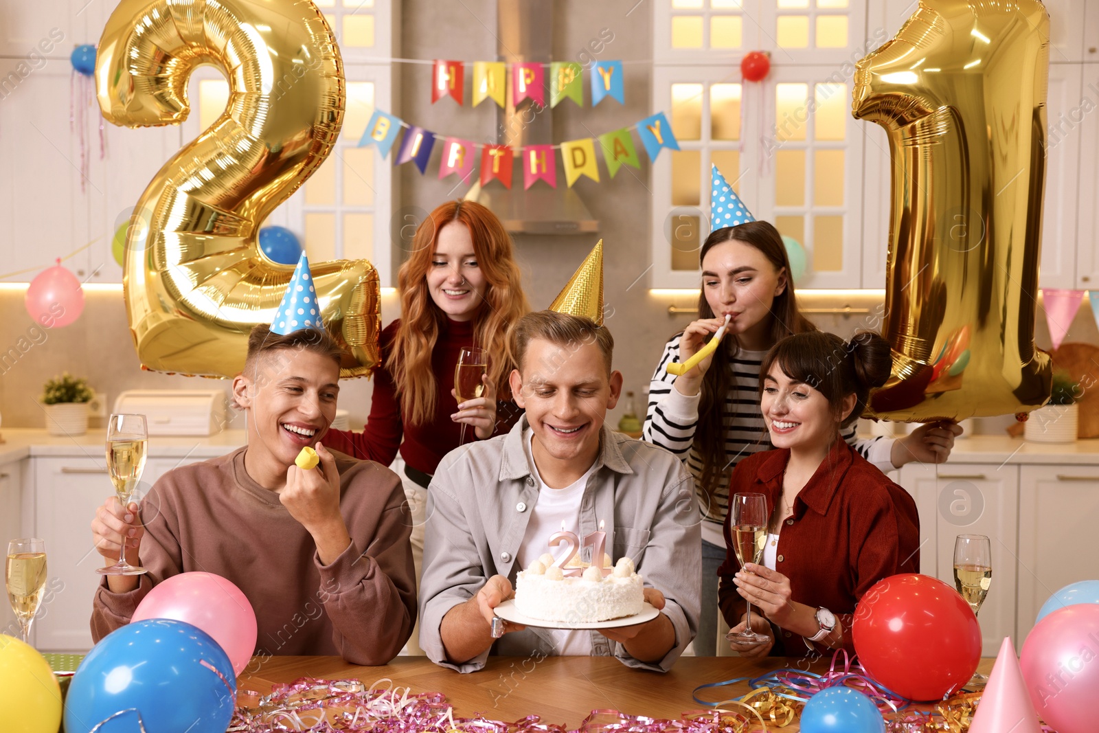 Photo of 21st birthday. Group of happy friends with tasty cake having coming of age party at home