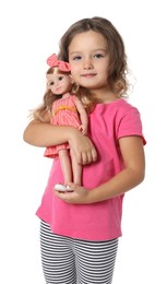 Photo of Cute little girl holding doll on white background